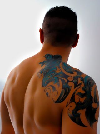 Muscular Man Looking At Camera Stock Photo - Download Image Now - Men,  Shirtless, Tattoo - iStock