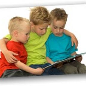 Older brother reading to younger ones