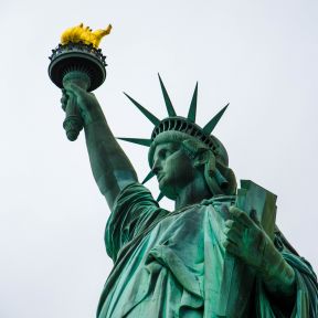Lady Liberty with her beacon of welcome