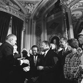 Lyndon Johnson meeting with Martin Luther King, Jr after signing the Voting Rights Act.