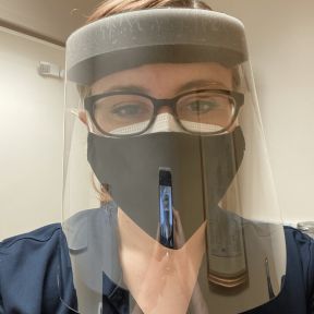 The author wearing personal protective equipment before a patient encounter.