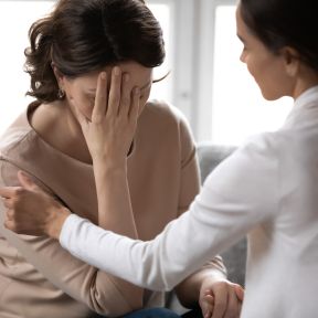 Healthcare Provider comforting a patient