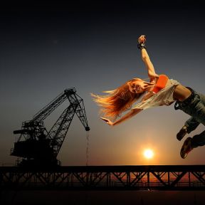 woman on air with crane background 