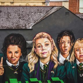 Mural of the "Derry Girls" from the TV comedy of the same name, near the Derry City Walls.
