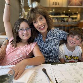 The author enjoying the moments with two of her four grandchildren