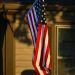 American flag hanging outside a home in Kansas, USA