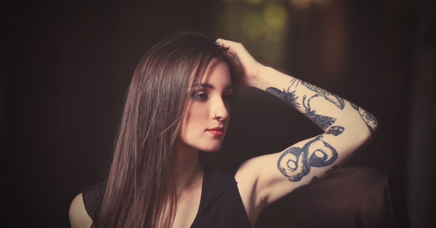 Side Portrait Of A Tattooed Viking Blonde Female And Her Unique Hairstyle  Stock Photo  Download Image Now  iStock