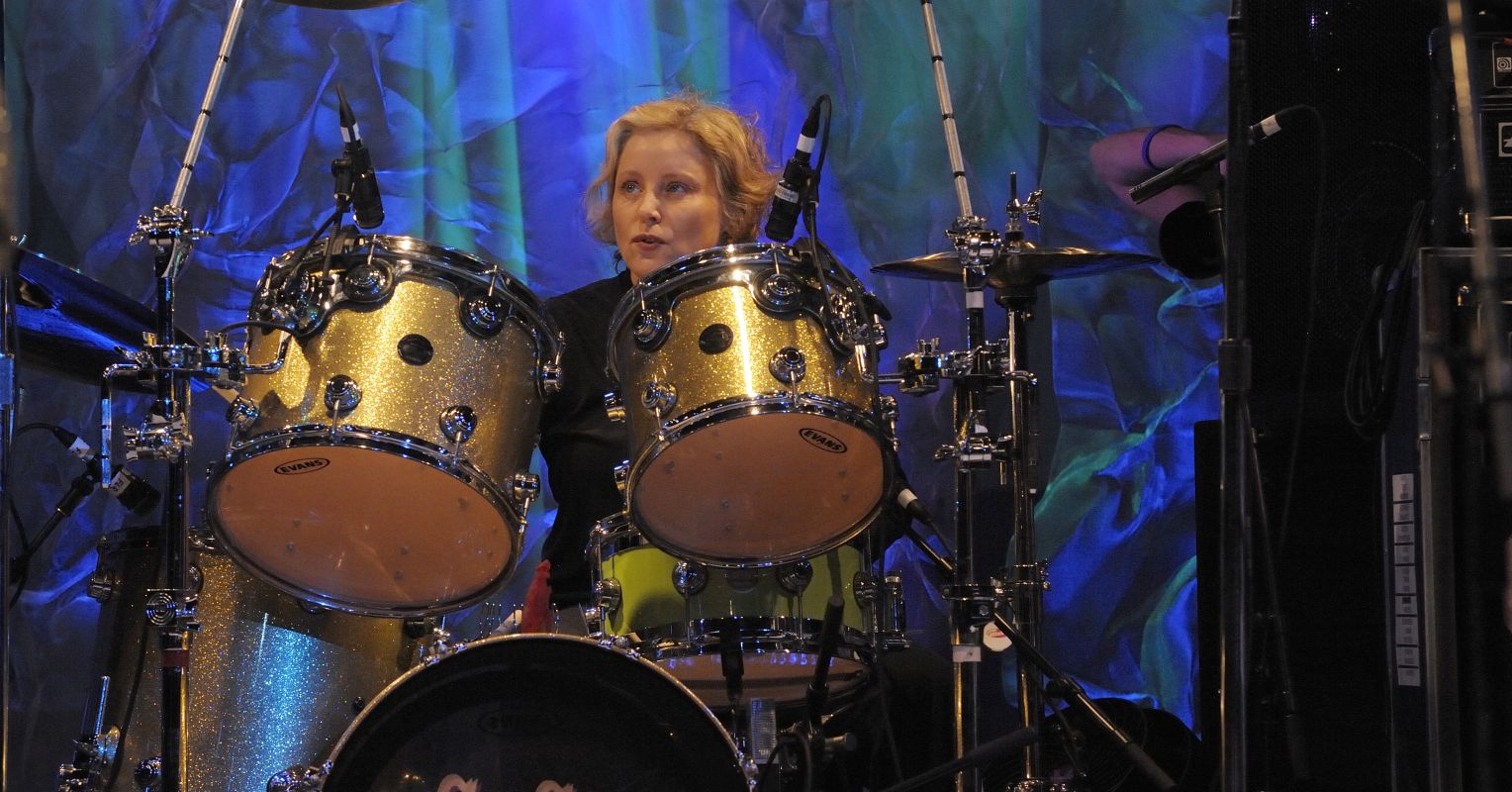 Why The Go Go’s Drummer Gina Schock Is a Chip Off the Old Block