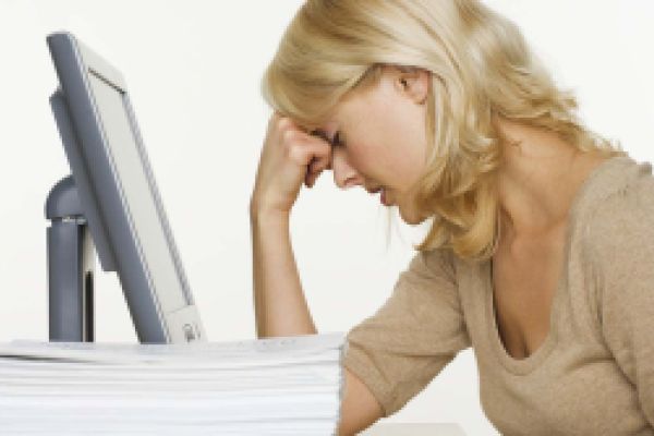 Frustrated woman in front of a computer