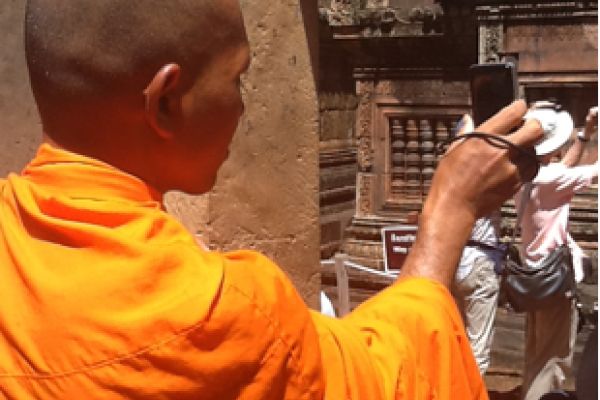 Buddhist monk with cell phone